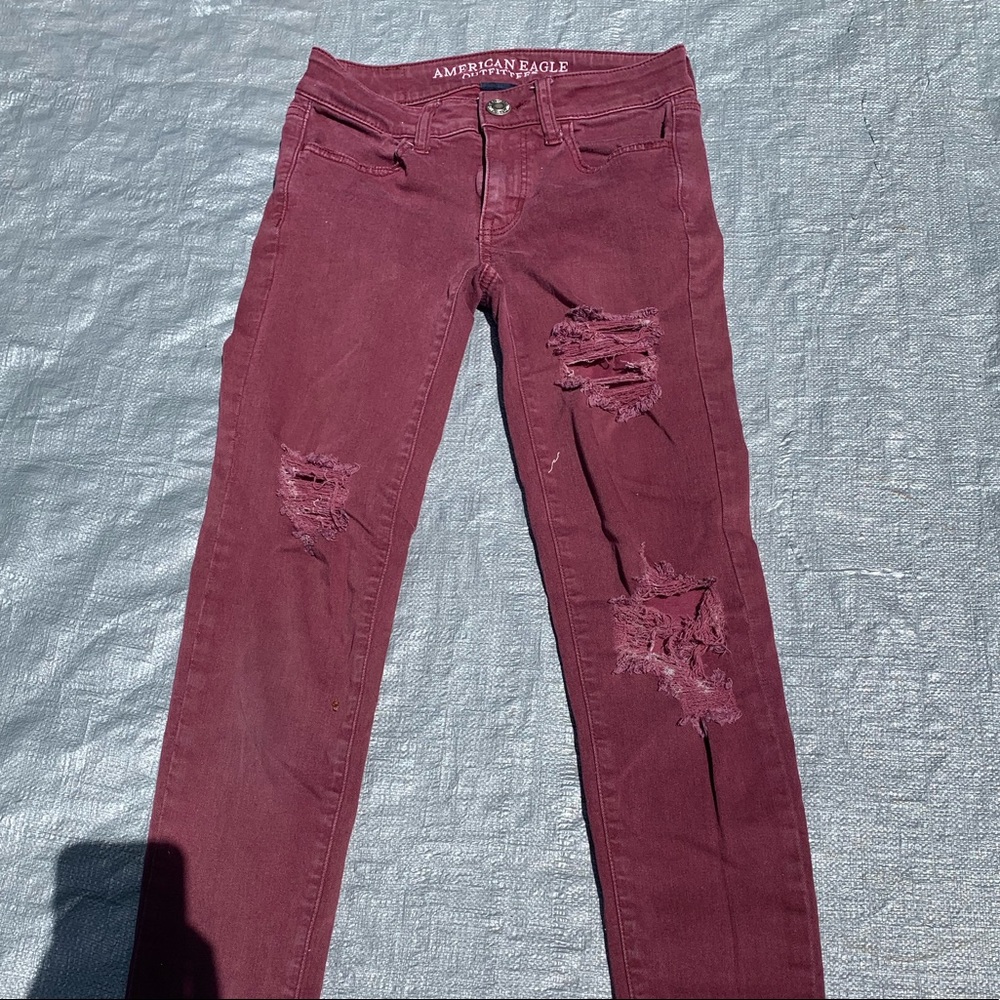 Burgundy red American Eagle skinny jeans